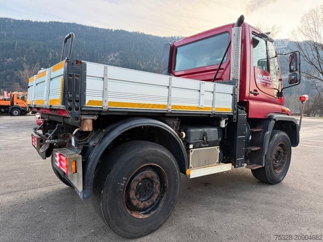 Camión volquete UNIMOG U 400 Dreiseitenkipper