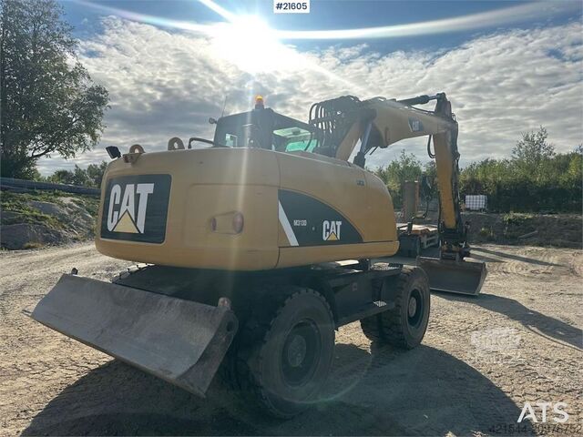 Колесный экскаватор CAT M313 D