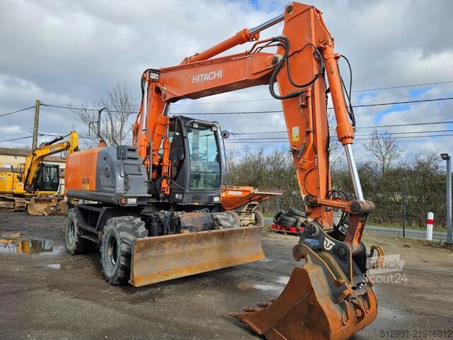 Escavadora sobre rodas HITACHI ZX 140 W