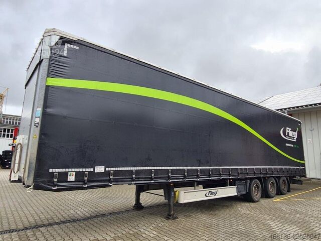 Auflieger mit Pritsche & Plane Fliegl 3-Achs Gardine Mega mit 7m Coilmulde