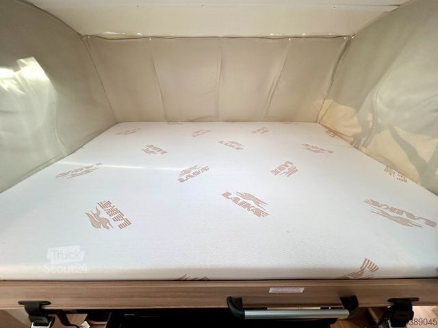 Інтегрований автокемпер LAIKA Kosmo 909 *Einzelbetten-Hubbett-Automatik*