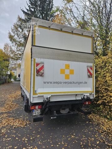 Lastbil med flak och presenning Mercedes-Benz Atego 1230L