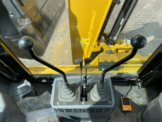 Combinação escavadora/carregador Caterpillar 424