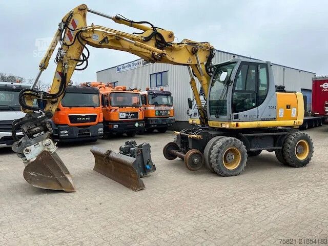 Escavadora de rodas New Holland MH Plus 2wege Bagger