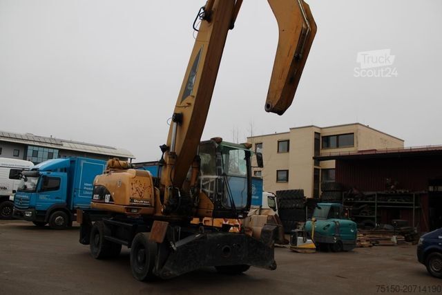 Riteņu ekskavators CATERPILLAR M 322 C MH Umschlagbagger Motor defekt Nr.: 380