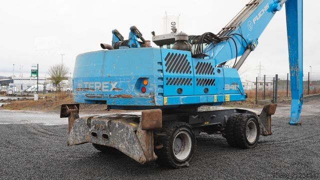 Gumikerekes kotrógép FUCHS MHL 340 Umschlagbagger Pratzen