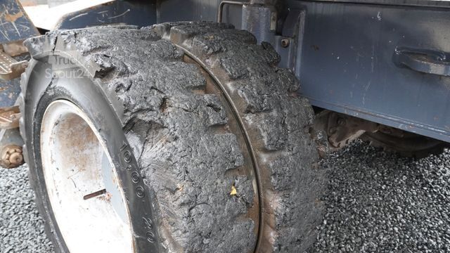 Gumikerekes kotrógép FUCHS MHL 340 Umschlagbagger Pratzen