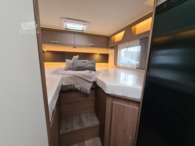 Ημιενσωματωμένο αυτοκινούμενο τροχόσπιτο CARADO T 328 *Für 5 Personen*pro + Paket*TV-Paket*