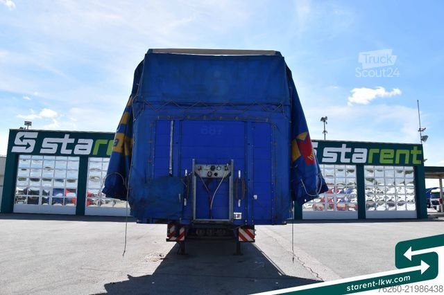 Åpen semitrailer med presenning Hangler Megatrailer Schräglader Coil Bordwand