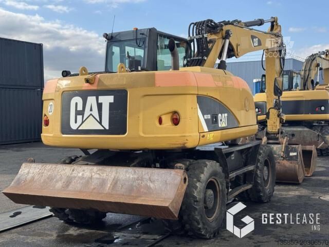 Escavatore gommato Caterpillar M313D
