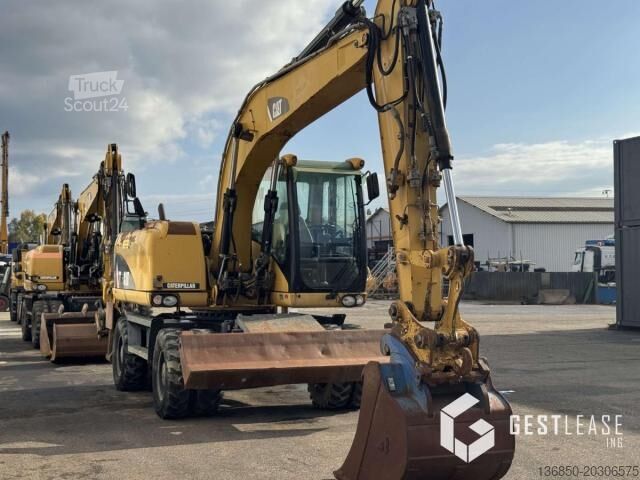 Escavatore gommato Caterpillar M313D