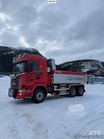 Tipper Scania R730 6x4 snow plow–equipped tipper truck with unde