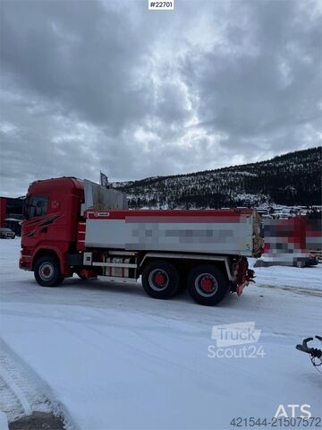 Tipper Scania R730 6x4 snow plow–equipped tipper truck with unde