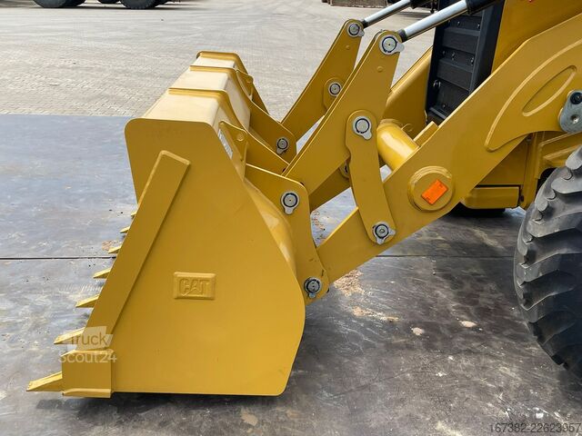 Kombination af gravemaskine og læsser Caterpillar 424