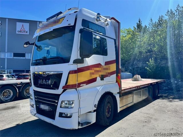 Платформенный трейлер MAN TGX 580 Flatbed truck.
