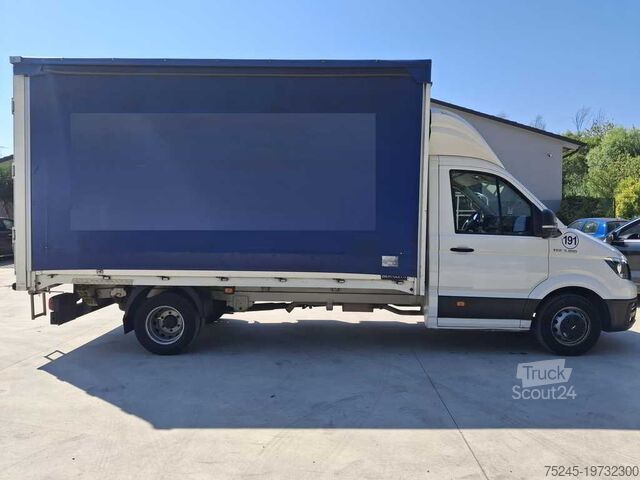 Furgoneta con lona corredera MAN TGE 3.180