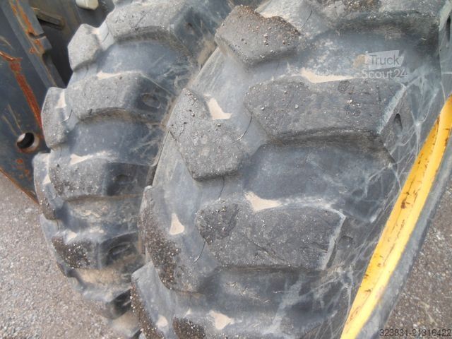 Escavatore gommato NEW HOLLAND WE 150