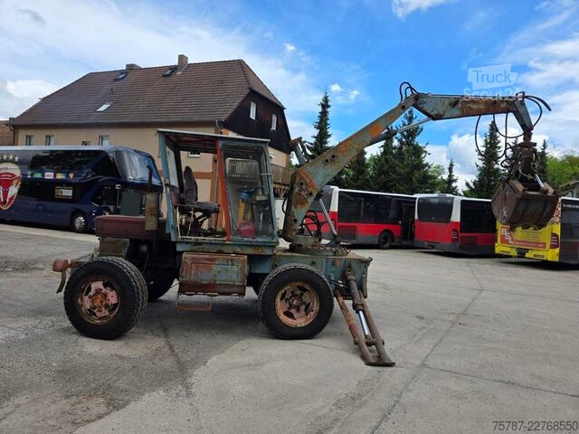 Excavator pe roți  Craiova IH Radbagger ( Romania ) mit 2 Schalengr