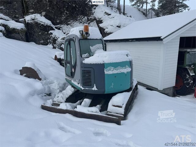 Mini-excavator Kobelco SK60SR excavator with digging bucket, hydraulic gr