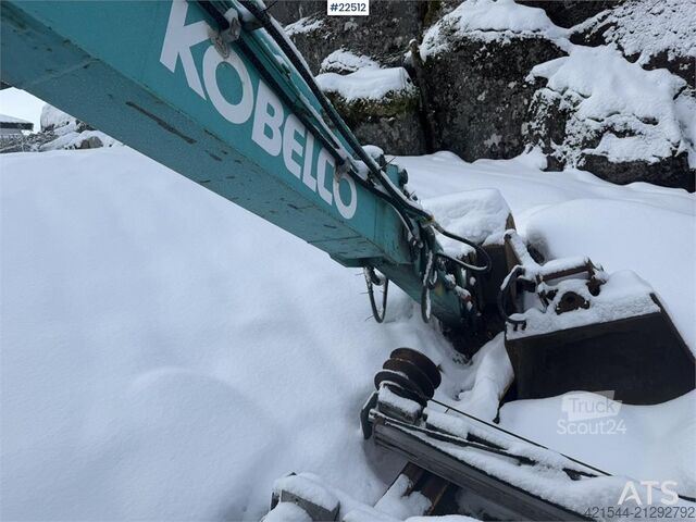 Mini-excavator Kobelco SK60SR excavator with digging bucket, hydraulic gr