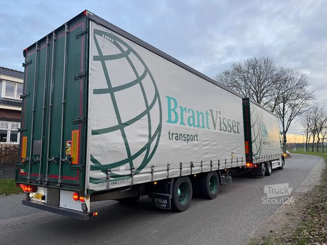 Transport af volumen Volvo FH 460 Globe XL 6 x 2 volumencombi met 2 ass aa...