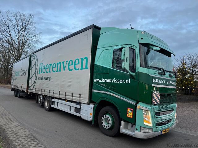 Transport af volumen Volvo FH 460 Globe XL 6 x 2 volumencombi met 2 ass aa...
