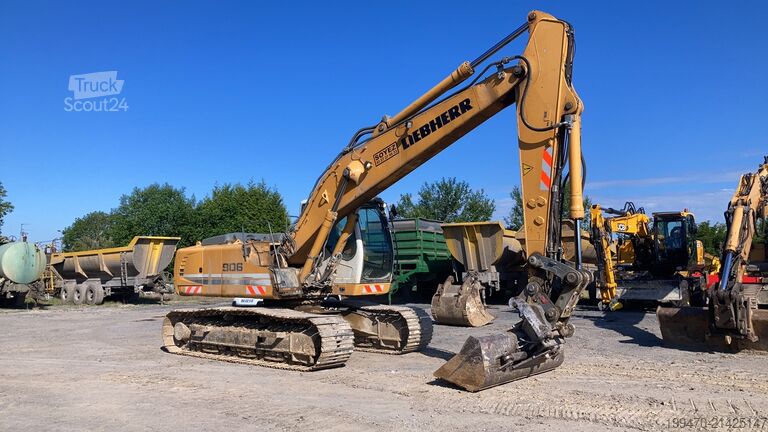 Rupsgraver Liebherr R906 LC Litronic with two buckets