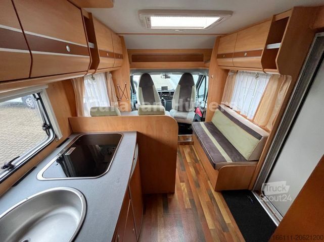 Teilintegriertes Wohnmobil GLUECKSMOBIL T 345 - Festbett - Klima - Sat/TV - Solar -