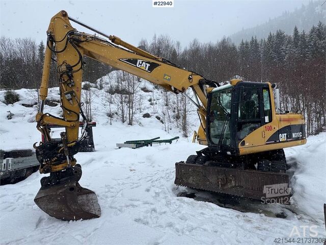 Riteņu ekskavators CAT M313 C