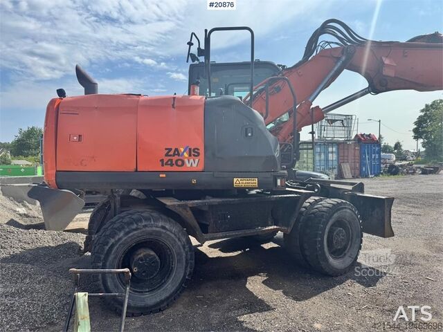 Radbagger Hitachi ZX140W-5B Wheeled excavator w/ Rototilt and 2 buck