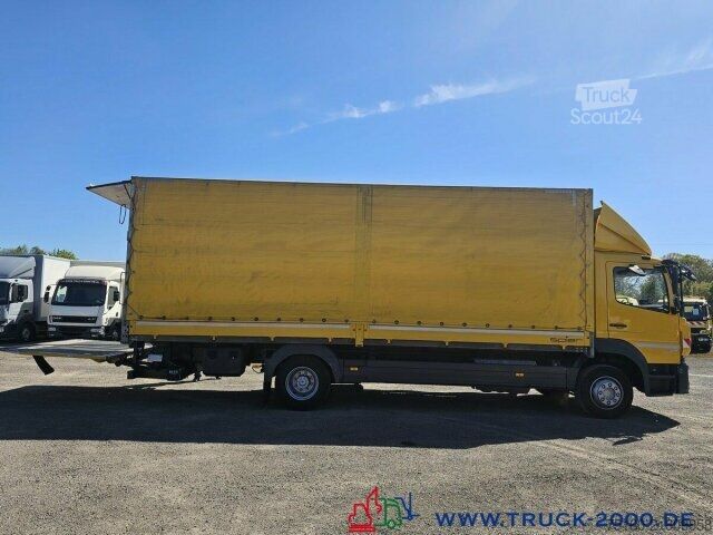 Вантажівка з платформою і тентом Mercedes-Benz Atego 1227 Plane Spriegel LBW BÄR 1.500 Kg + AHK