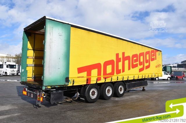 Nyitott ponyvás félpótkocsi KÖGEL Palettenkasten Lochrahmen SAF Achsen Zurringe