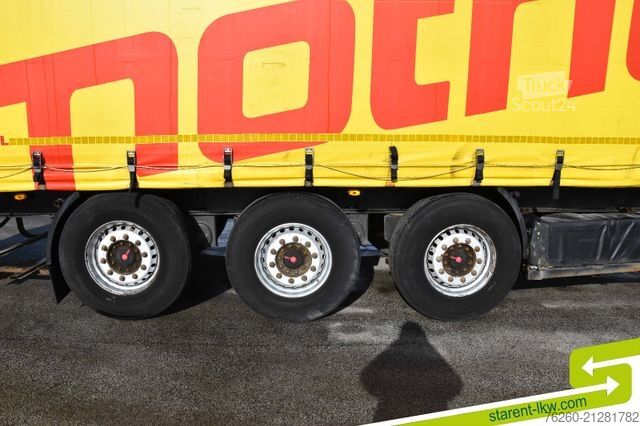 Nyitott ponyvás félpótkocsi KÖGEL Palettenkasten Lochrahmen SAF Achsen Zurringe