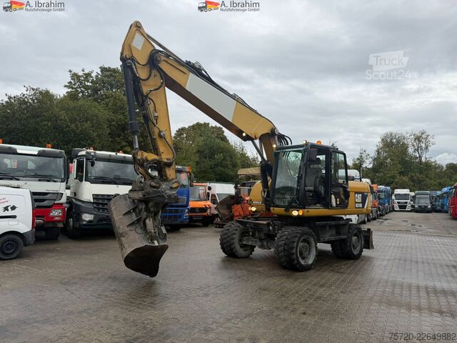 Kolesový bager Caterpillar M318D Schnellwechsler Schwenkfunktion OilQuick OQ70 55 Klima Verstellausleger