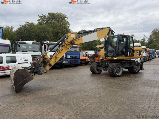 Kolesový bager Caterpillar M318D Schnellwechsler Schwenkfunktion OilQuick OQ70 55 Klima Verstellausleger
