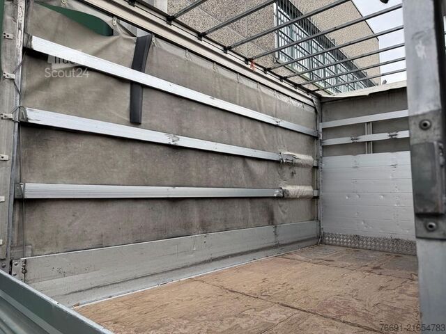 Transportador con plataforma y toldo Isuzu NPR 35 Centinato con Telo