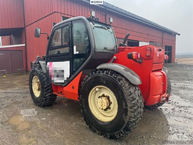 Caricatore Manitou MLT 633 telehandler with hydraulic pallet forks.