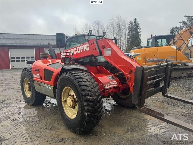 Caricatore Manitou MLT 633 telehandler with hydraulic pallet forks.