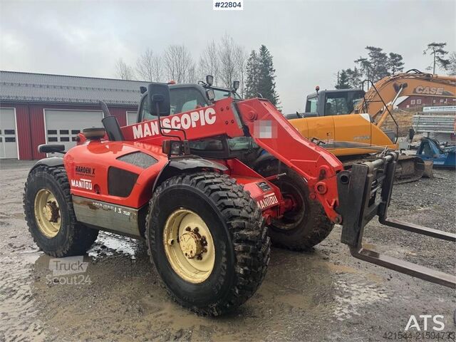 Caricatore Manitou MLT 633 telehandler with hydraulic pallet forks.