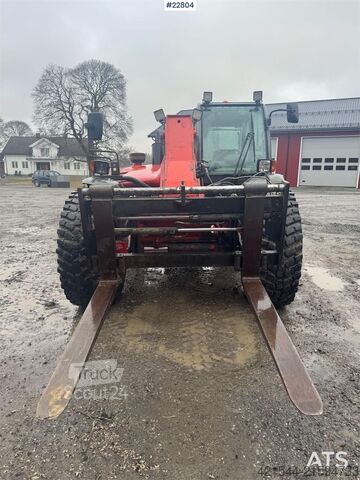 Caricatore Manitou MLT 633 telehandler with hydraulic pallet forks.