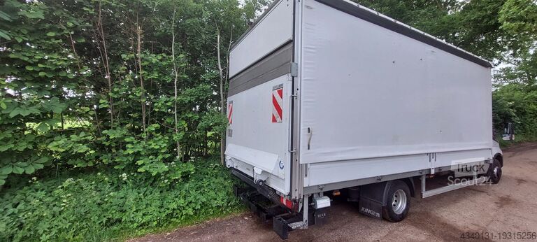 Lastbil med flak och presenning Iveco 70C18HA8/P