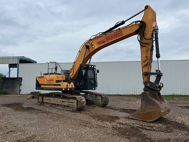 Pásový bagr Hyundai HX300 NL with a bucket