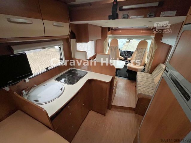 Ημιενσωματωμένο αυτοκινούμενο τροχόσπιτο CARADO T 348 - Hub/Festbett - Klima - Garage -