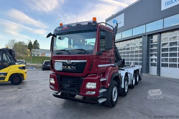 Kanca kasalı yük kamyonu (roll-off) MAN TGS 35.500 10x4 Trösch