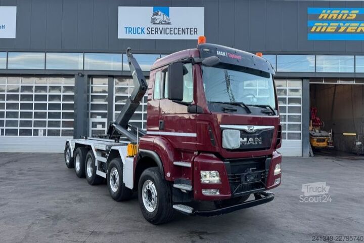 Kanca kasalı yük kamyonu (roll-off) MAN TGS 35.500 10x4 Trösch