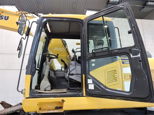 Pyöräalustainen kaivinkone KOMATSU PW140