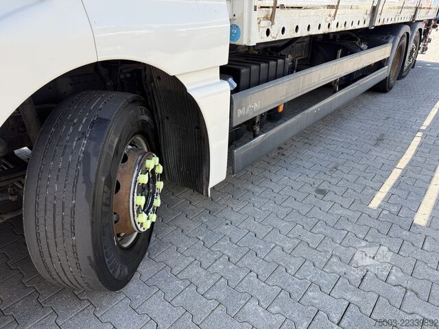 شاحنة مسطحة MAN TGX 26.440 6X2 Kran Hiab 144