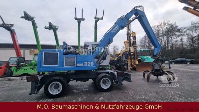Pelle sur pneus FUCHS MHL 320 / ZSA / AC / Hochfahrbare Kabine /