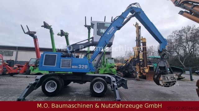 Pelle sur pneus FUCHS MHL 320 / ZSA / AC / Hochfahrbare Kabine /