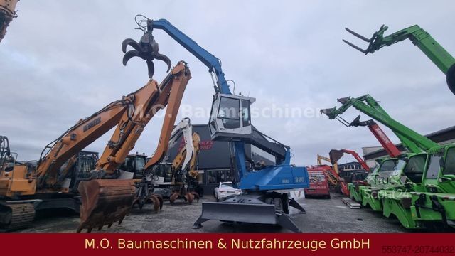 Pelle sur pneus FUCHS MHL 320 / ZSA / AC / Hochfahrbare Kabine /